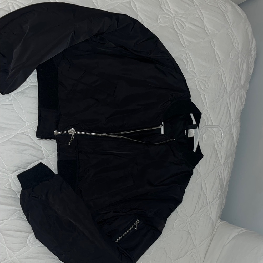 Sleek Black Bomber Jacket with Zipper Detail